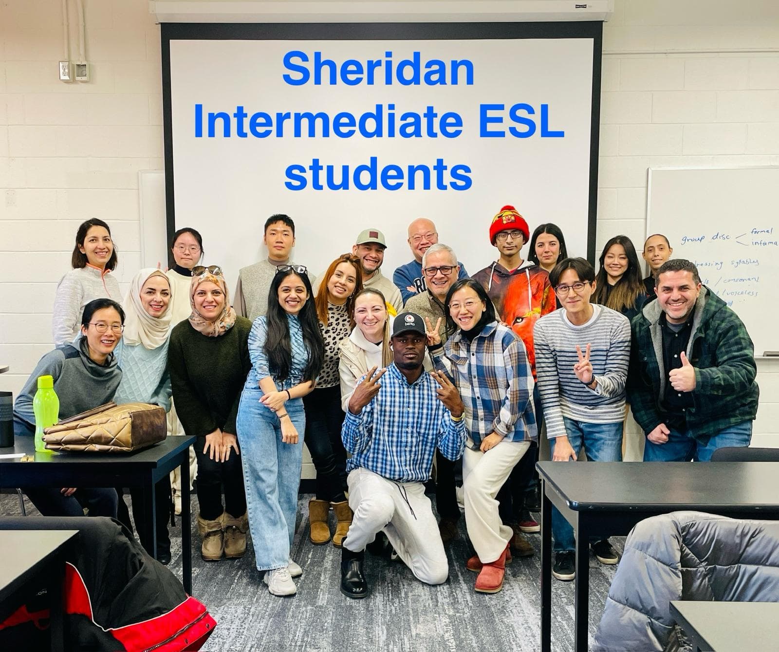 Hetvi with her intermediate ESL class at Sheridan College — students from many countries posing together